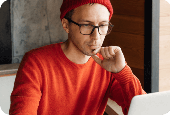 Person looking at the computer - building your unique brand