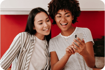 Two people looking at the phone - cherishing online community