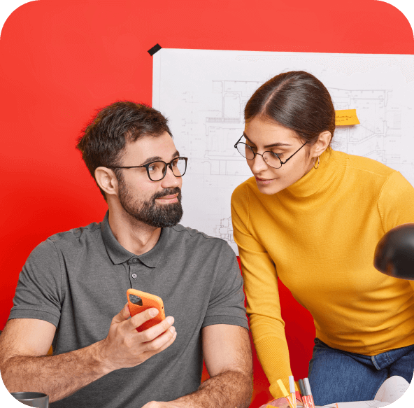 Two people looking at the phone