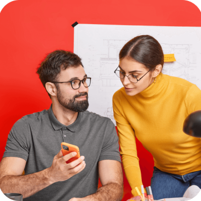 Two people looking at the phone